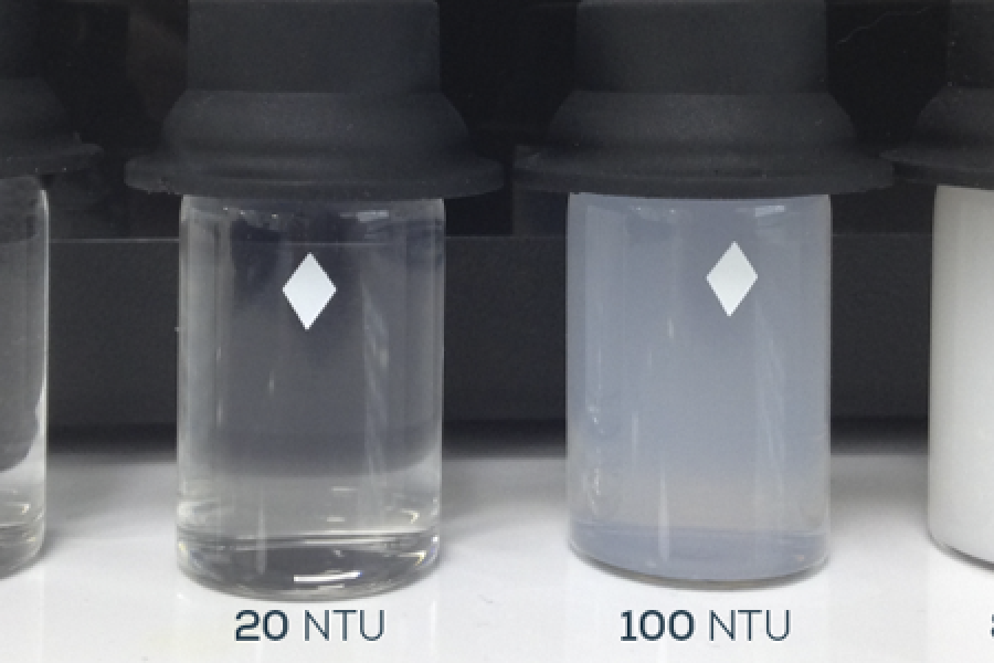 Four test tubes showing various levels of turbidity