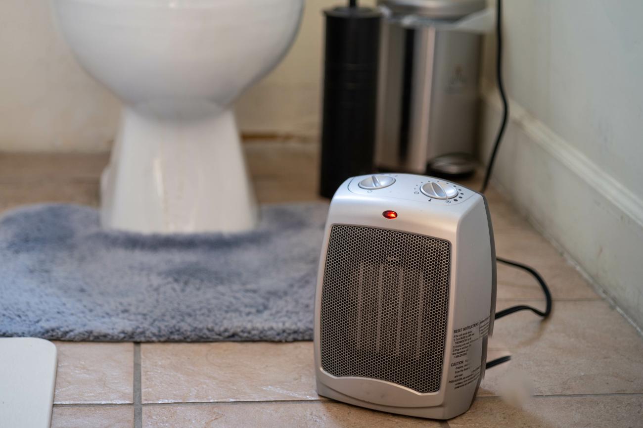 A small space heater in a bathroom