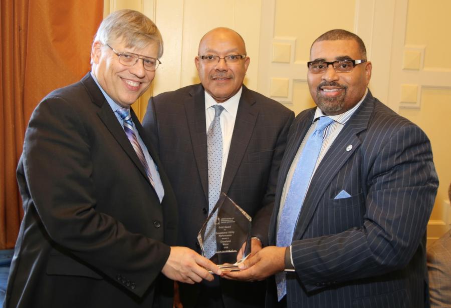 Commissioner of Water Alex Margevicius and Director of Public Utilities Robert Davis hold an award from the Association of Metropolitan Water Agencies